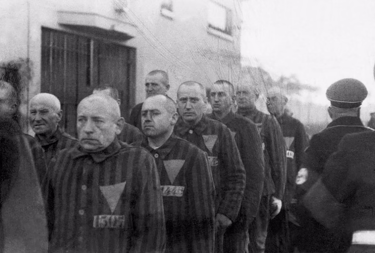 upwards of 15,000 gay men were sent to concentration camps. Inside the camps, they were forced to wear a pink inverted triangle on their uniforms – clearly marking them as LGBTQ
